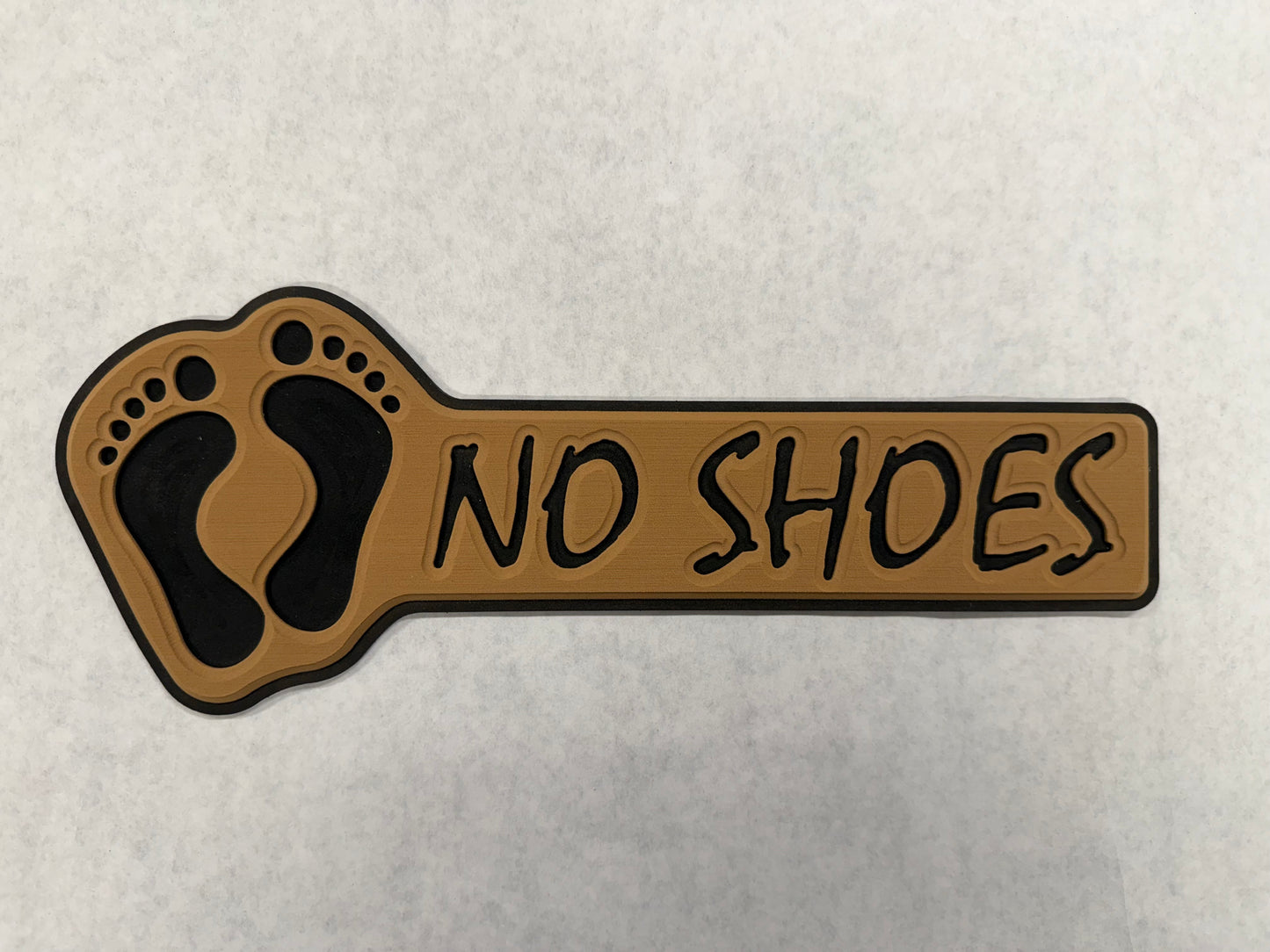GripTurf No Shoes Pad in teak over black with routed NO SHOES lettering and 3M adhesive.