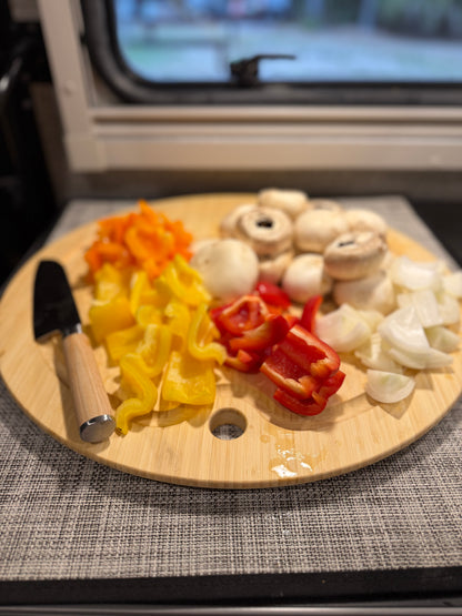 GripTurf Bamboo Prep Pro cutting board and sink cover shown in use with vegetables and a kitchen knife.