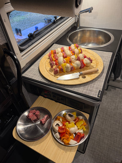 GripTurf Prep Pro and flip‑up counter in the EKKO kitchen holding vegetables, mushrooms, and meat during meal prep.