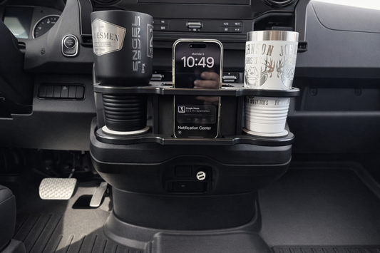 GripTurf Dash Port installed in the Mercedes Sprinter EKKO holding two travel mugs and a phone for organized front‑cab storage.