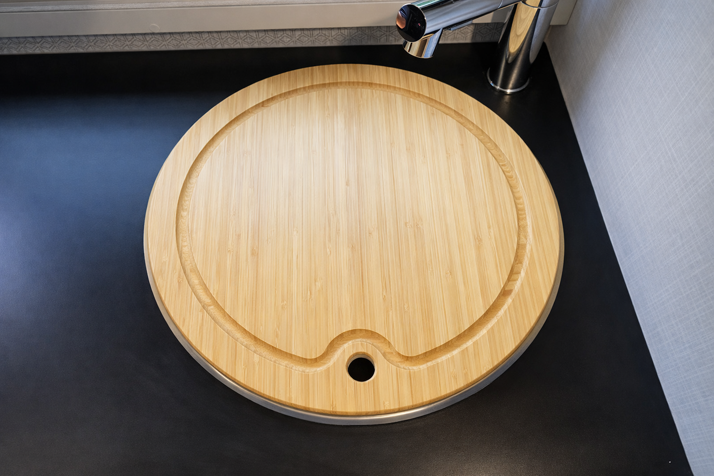 GripTurf Bamboo Prep Pro cutting board and sink cover installed in the Winnebago EKKO kitchen.