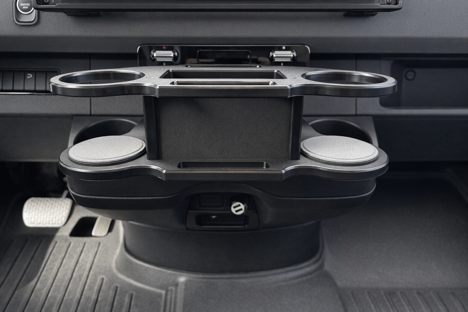 GripTurf Dash Port installed in the Mercedes Sprinter EKKO center console for added cup and gear storage.