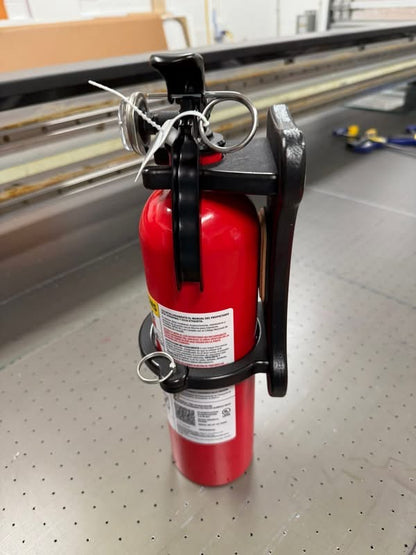 GripTurf RV fire extinguisher mount with extinguisher shown in a clean studio shot.