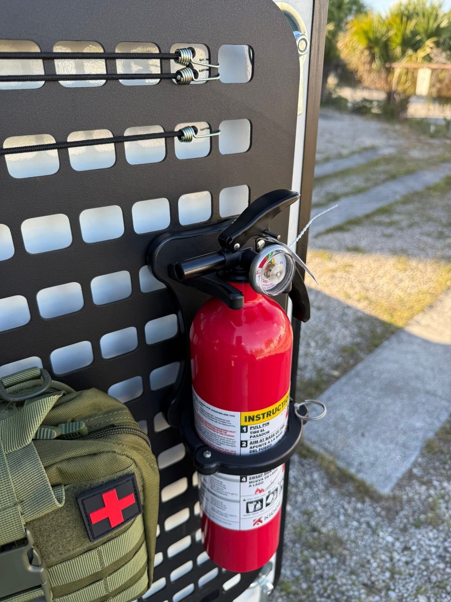 GripTurf RV fire extinguisher mount installed on the Winnebago EKKO MOLLE rack