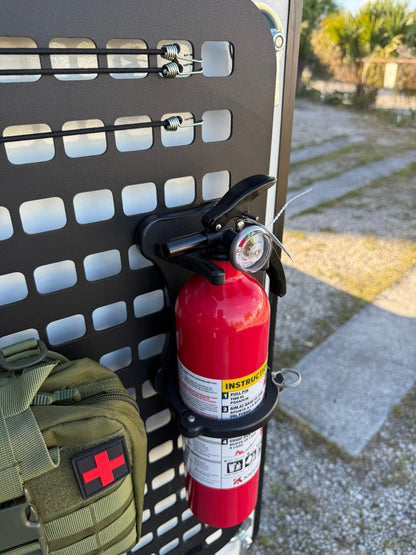 GripTurf RV fire extinguisher mount installed on the Winnebago EKKO MOLLE rack