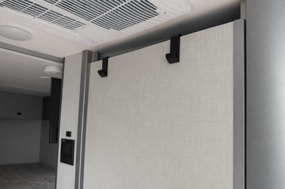 GripTurf EKKO Over‑Door Hook 2‑Pack in black mounted on the Winnebago EKKO bathroom door.