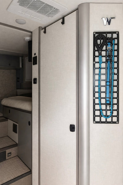 GripTurf EKKO Over‑Door Hook 2‑Pack in black mounted on the Winnebago EKKO bathroom door.