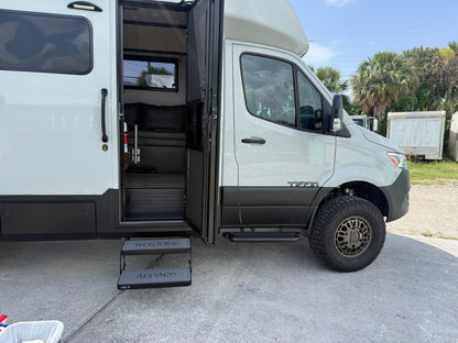 Tiffin Open Trail RV upgraded step pads with high‑traction ‘WELCOME’ and ‘ABOARD’ inserts at the entry door.”