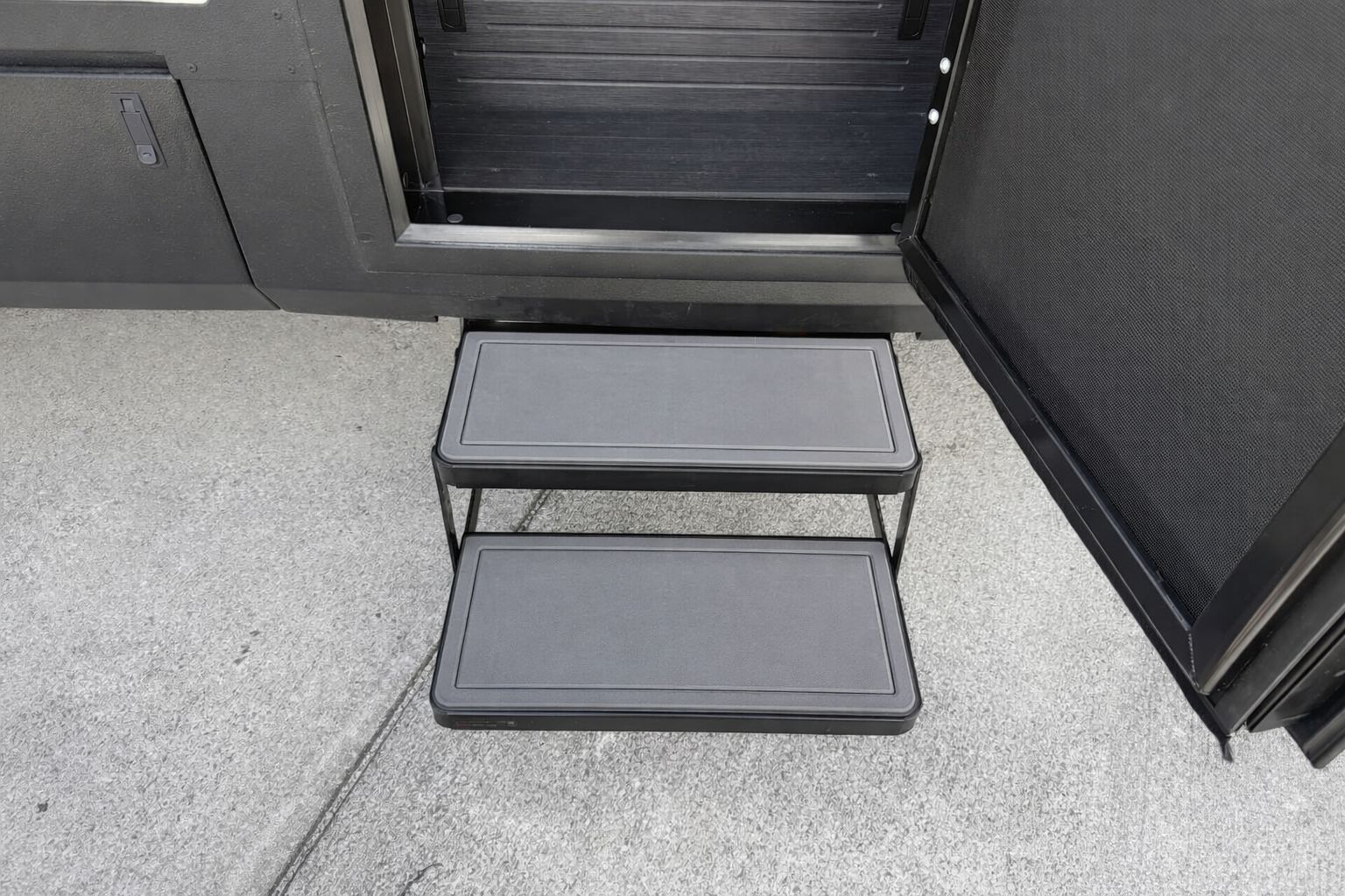  Tiffin Open Trail RV step pads with high‑traction grip installed on entry steps for safer, slip‑free access