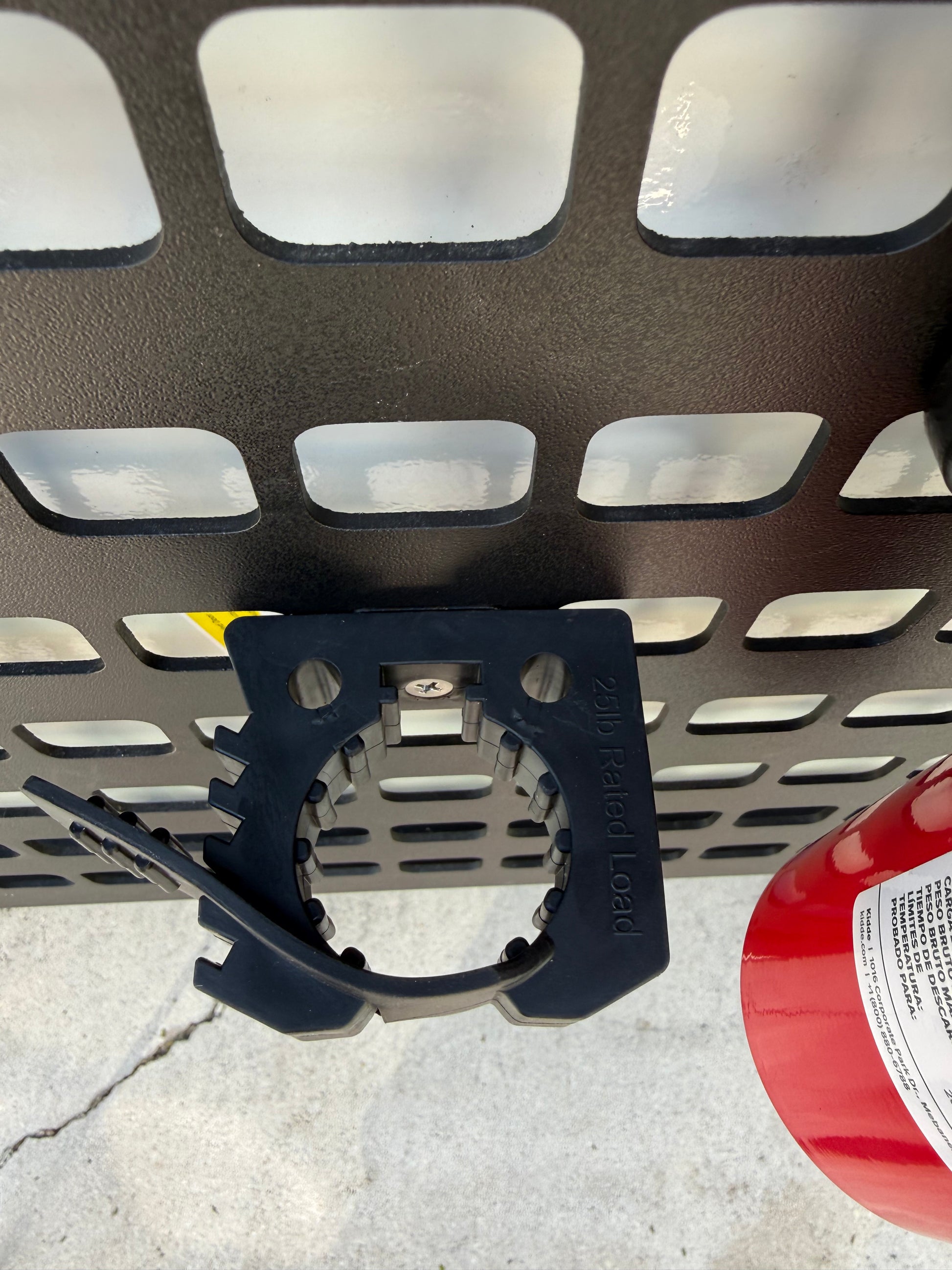 GripTurf 25‑lb rubber tool mount with MOLLE Nut secured on the EKKO MOOLE rack.”
